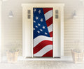 American flag design on a door with a white house exterior.