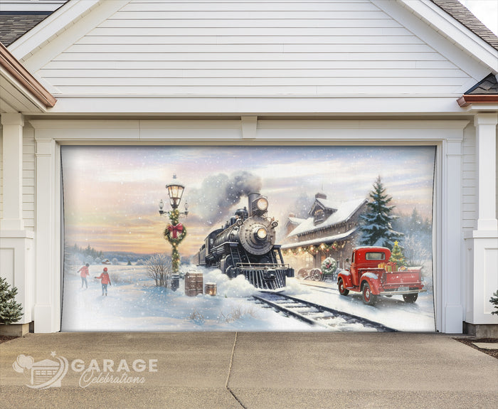 Decorative garage door with a winter scene featuring a train and red truck.