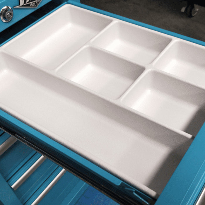 Open-drawer view of teal salon cart showing plastic drawer organizer tray