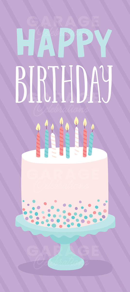 Birthday cake with lit candles on a purple background