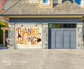 Garage door with Thanksgiving-themed design in front of a house