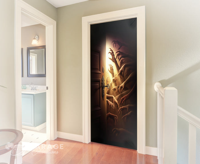 Horrific design on a door with a monster hands emerging, in a room with a staircase and bathroom.