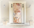 Decorative door with 'Hello Autumn' text and leaf design in a home entrance.