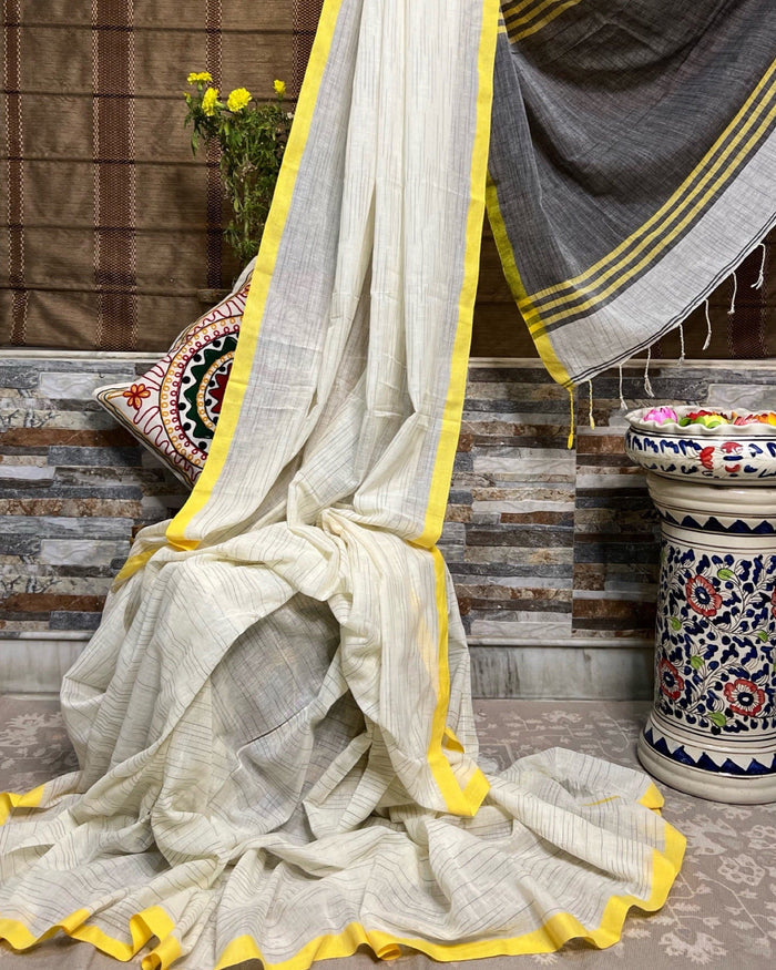 ShopAaMe Holud Paare saree in white yellow khaadi cotton