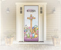 Decorative door with Easter-themed design featuring a cross, bunnies, and eggs on a white wall.