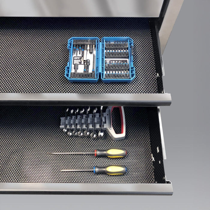 Black drawer liner installed inside a toolbox drawer, showing textured non-slip surface in use
