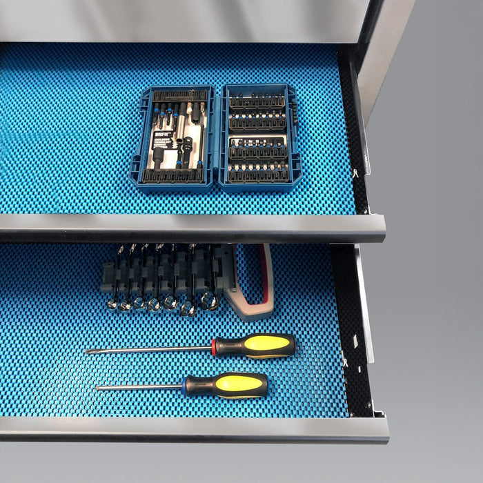 Teal drawer liner installed inside a toolbox drawer, showing textured non-slip surface in use