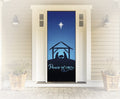 Decorative door with nativity scene and 'Peace on Earth' text in a home setting