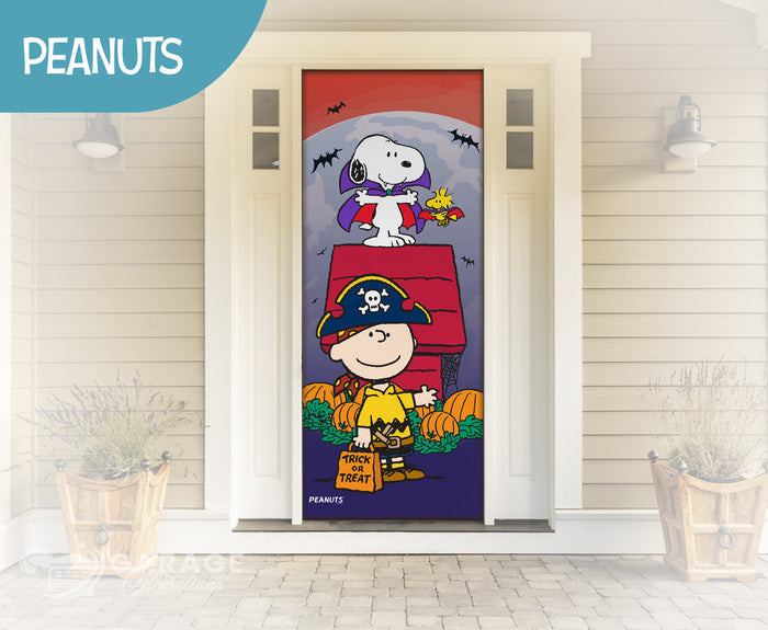 Snoopy and Charlie Brown characters in Halloween costumes on a roof with pumpkins and bats on a house front door.