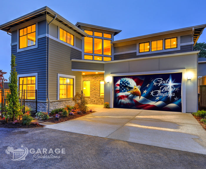 Modern house with a decorative garage door featuring an American flag, eagle, and the words God Bless America.